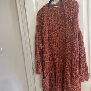 Fashion on earth, large.  Pink sweater.